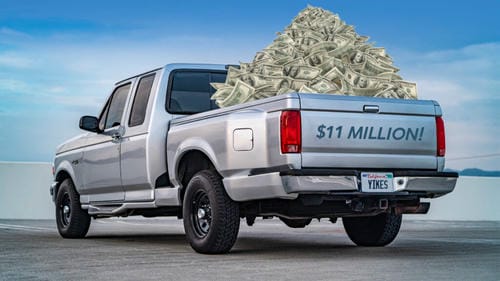 A silver pickup truck loaded with a huge pile of cash, labeled “$11 MILLION!” and “YIKES,” humorously depicting extreme car-related expenses.