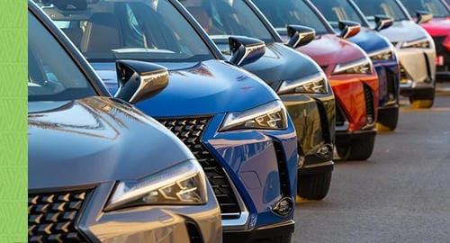 A line of colorful Lexus SUVs parked in a row.