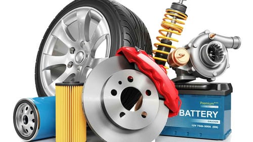 A collection of car parts, including a tire, brake disc, shock absorber, turbocharger, battery, oil filter, and air filter.